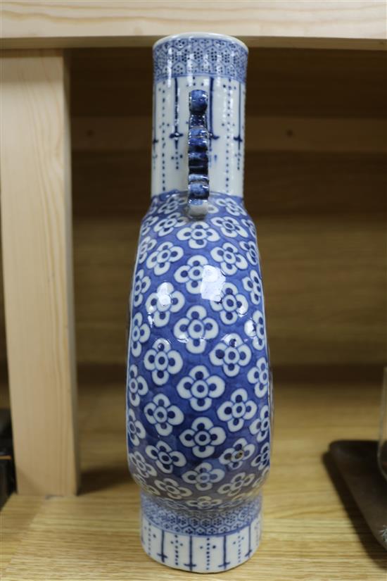 A Chinese blue and white moon flask decorated with dragons